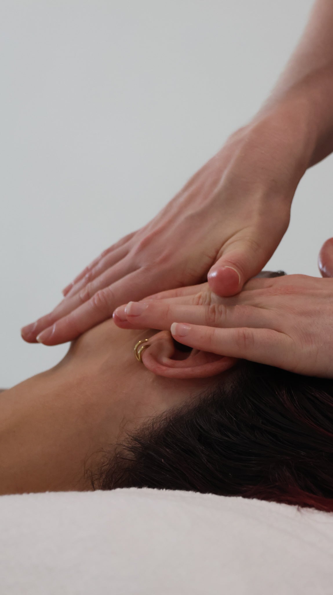 Client receiving a sculpting facial massage at The Skin Suite Collective in Perth.