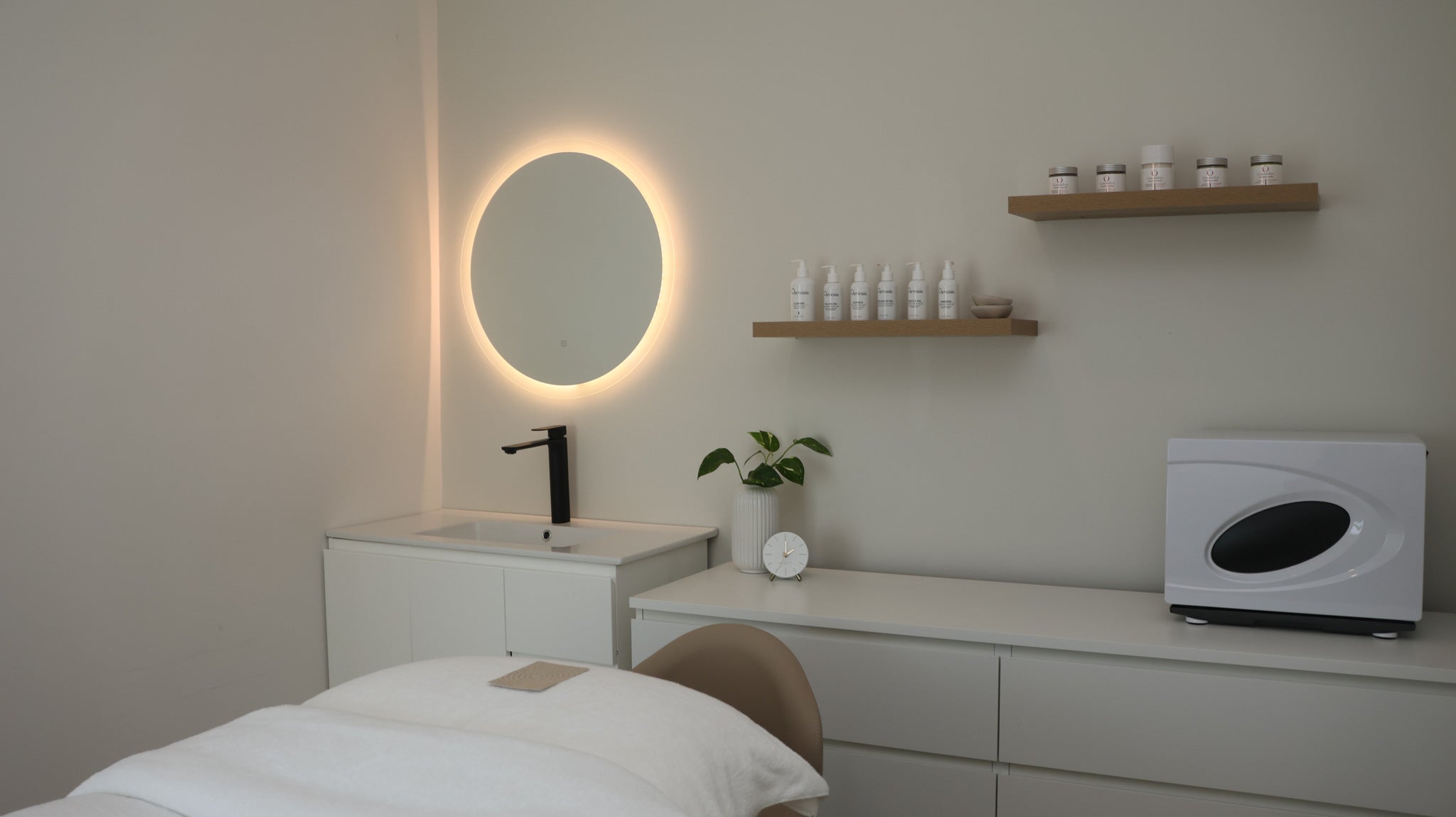 Luxury treatment room at The Skin Suite Collective in Perth, designed for holistic skin treatments, relaxation facials, and nervous system-focused wellness experiences.